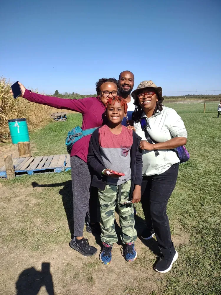 Visitors at Lynd Maze Fest beside the corn field