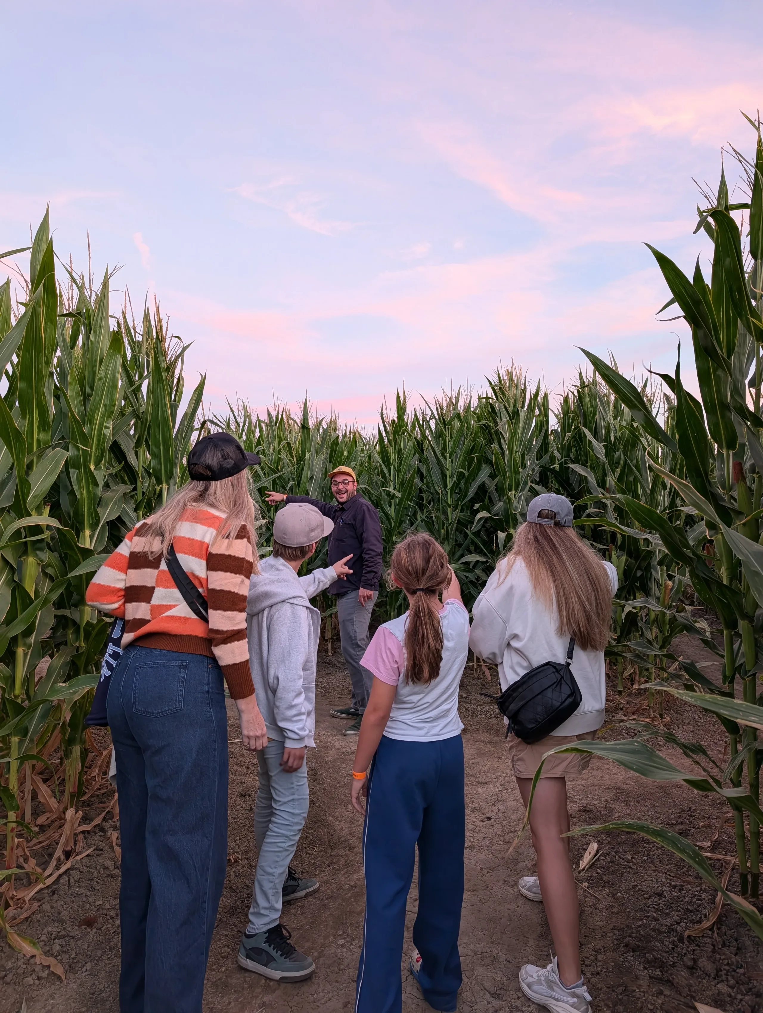 Visitors following a corn-maze path at Swank Farms
