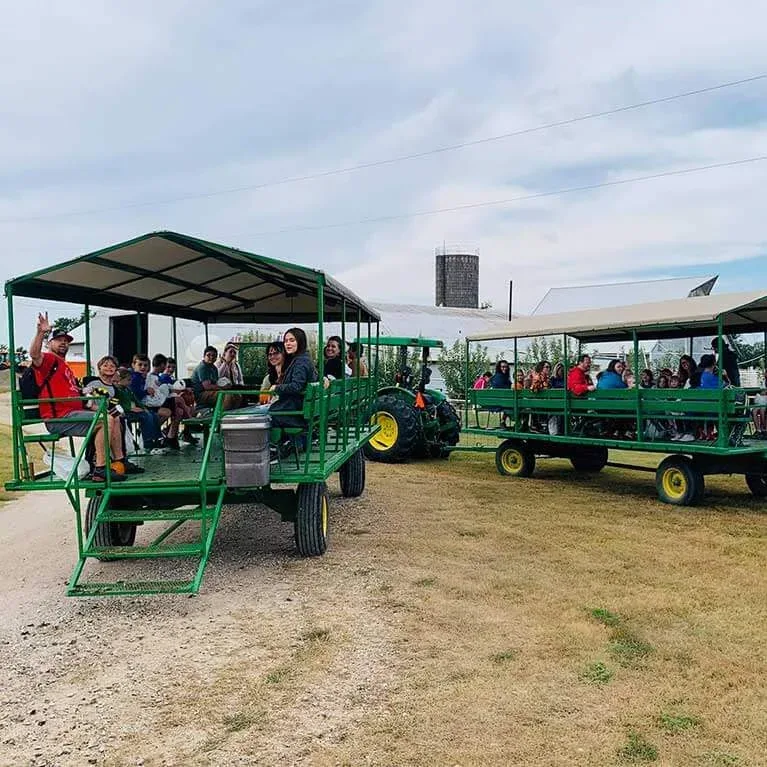 Visitors boarding tractor-drawn wagons at Walters’ Pumpkin Patch