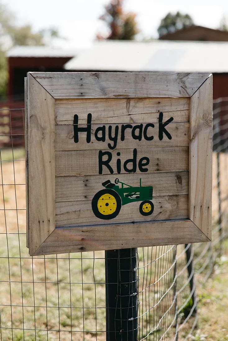 A wooden Hayrack Ride sign at Wills Family Orchard